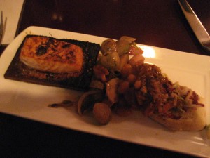 Cedar-planked salmon, roasted brussels sprouts and BBQ duck confit