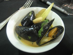 Black mussels in red curry coconut broth