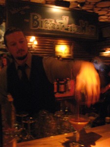 Bartender Ian pouring Caroline a Manhattan